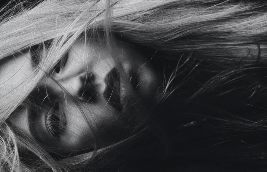 black and white image of blonde girl with dead hair