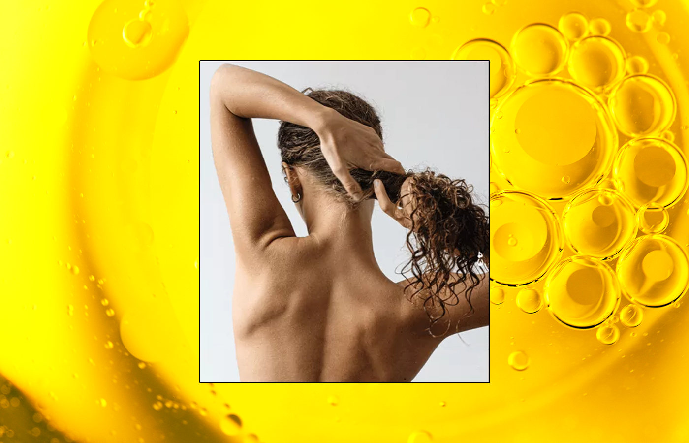 woman brushing through hair after using Castor Oil for Hair Growth