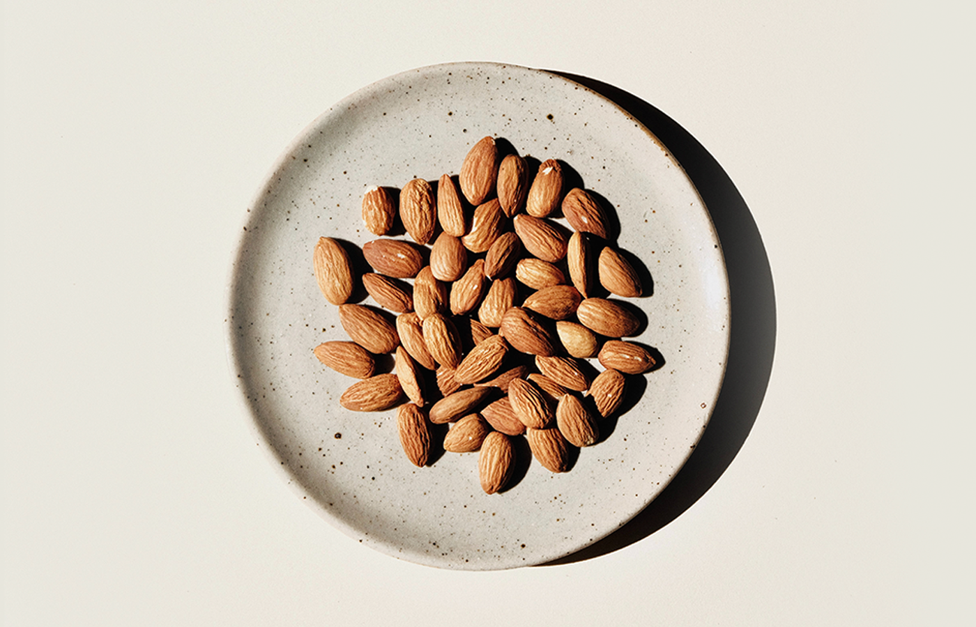 almonds in a bowl as recommended as a great food for hair