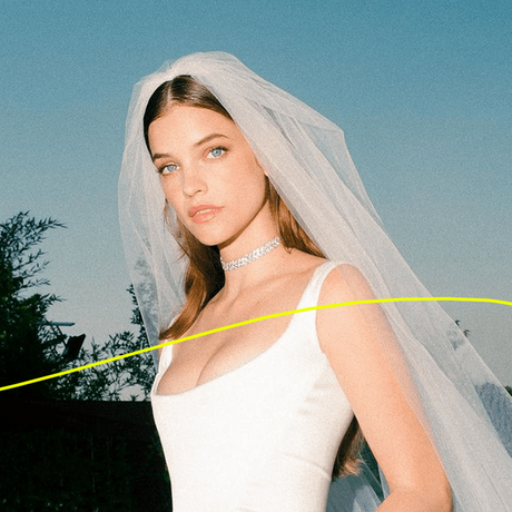 barbara palvin using advanced wedding hair and makeup tips on her wedding day. photo captured outside with veil and sunset