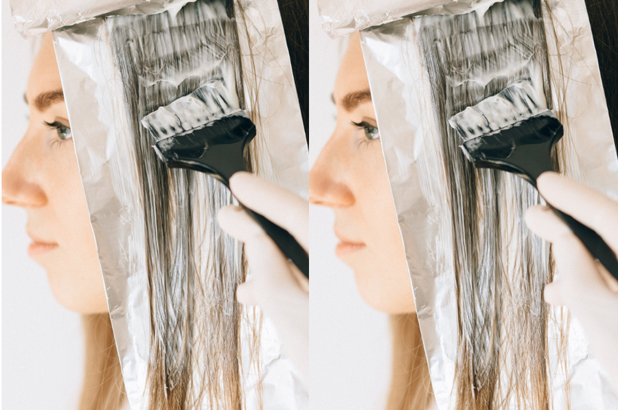 Picture of a woman having her hair dyed, wondering if it's safe to colour hair.