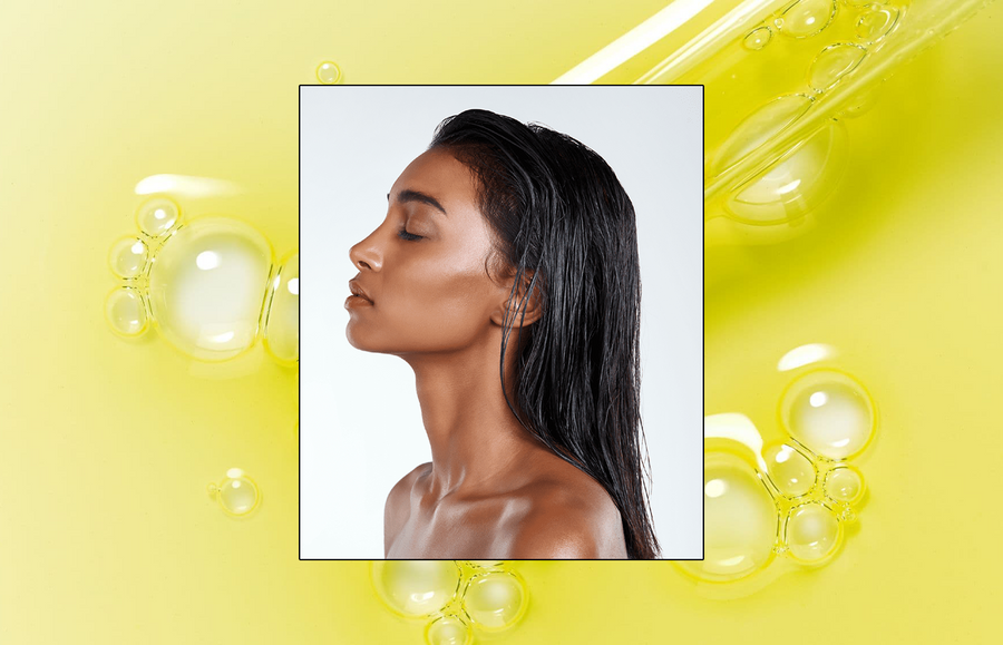 A woman delicately applies a natural pre-wash treatment to her hair, emphasizing its importance in hair care routine.