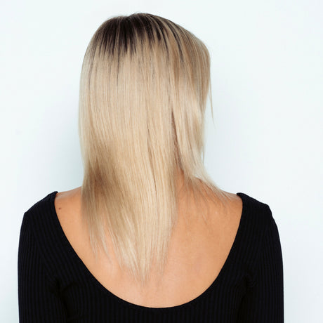 least damaging hair extensions for thin hair regrowth woman donning platinum blonde 60 halo hair extensions