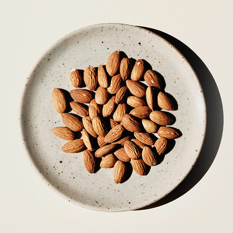 almonds in a bowl as recommended as a great food for hair