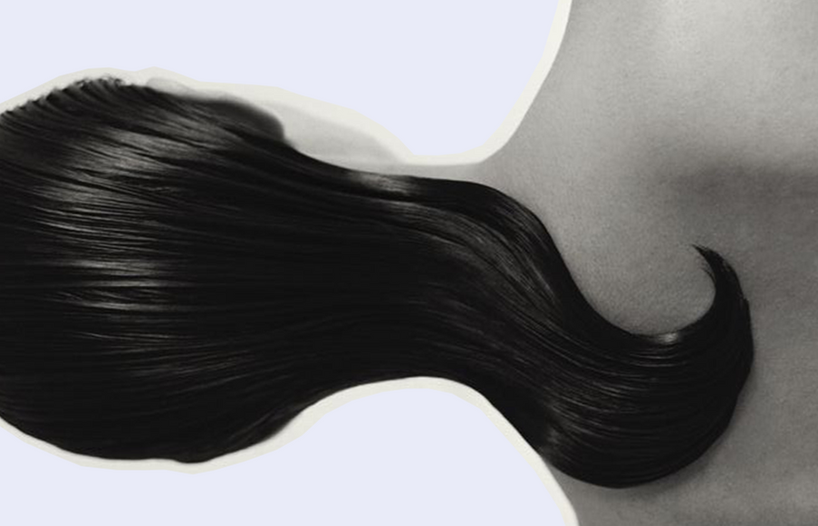 The image shows a close-up of a woman with beautifully smooth and shiny hair, serving as an inspiration for Ways on How to Get Smooth Hair Naturally