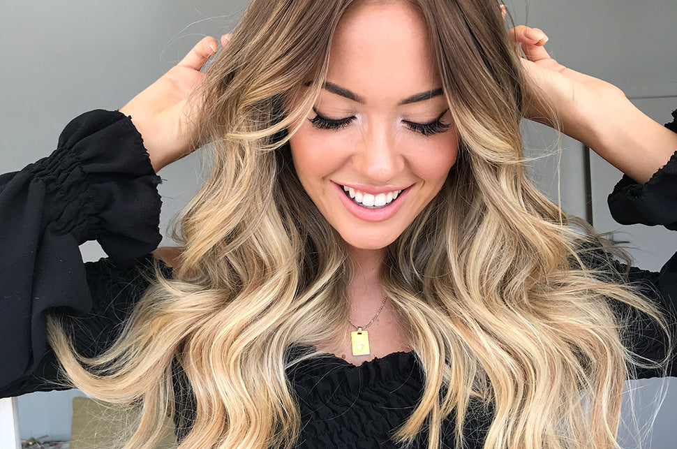 how to grow long hair woman donning Beige Blonde + Dark Blonde 613.10 halo hair extensions
