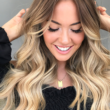 how to grow long hair woman donning Beige Blonde + Dark Blonde 613.10 halo hair extensions