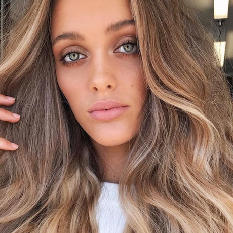 Girl wearing halo hair extensions on a Round Up Of The Best Hair Growth Products For Rapid Results