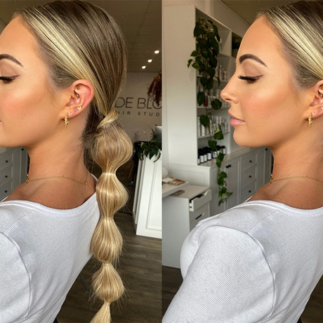 image of blonde woman with oily hair hairstyle in a low bubble pony