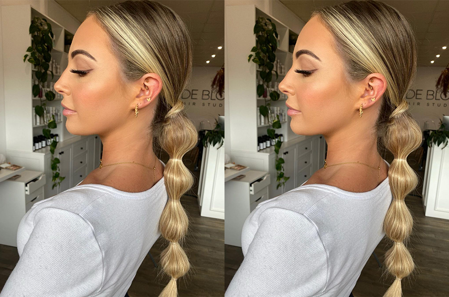 image of blonde woman with oily hair hairstyle in a low bubble pony