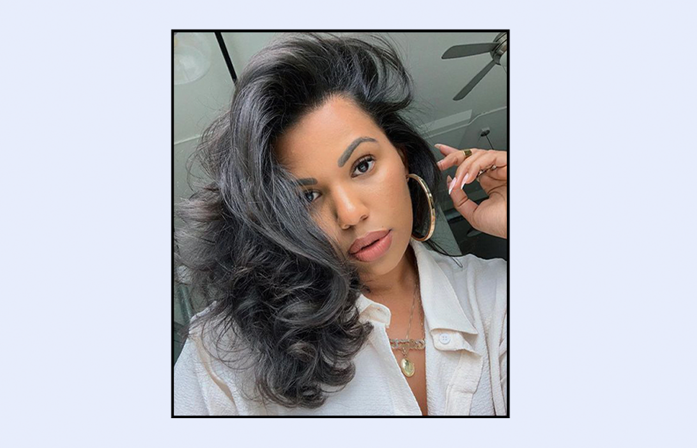 brunette with curled hair accompanied by her own research regarding hydrate hair meaning