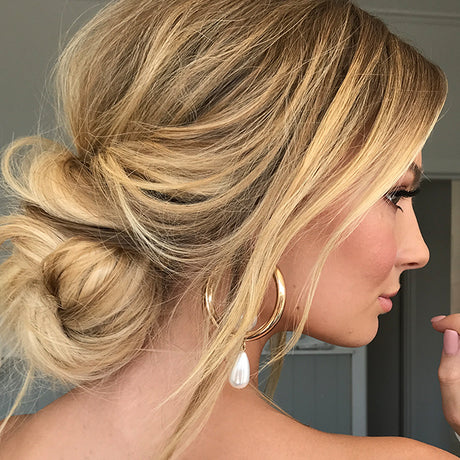 The 2-Minute Hack To Elevate Your Messy Bun girl donning beige blonde + derk blonde 613/10 halo hair extensions