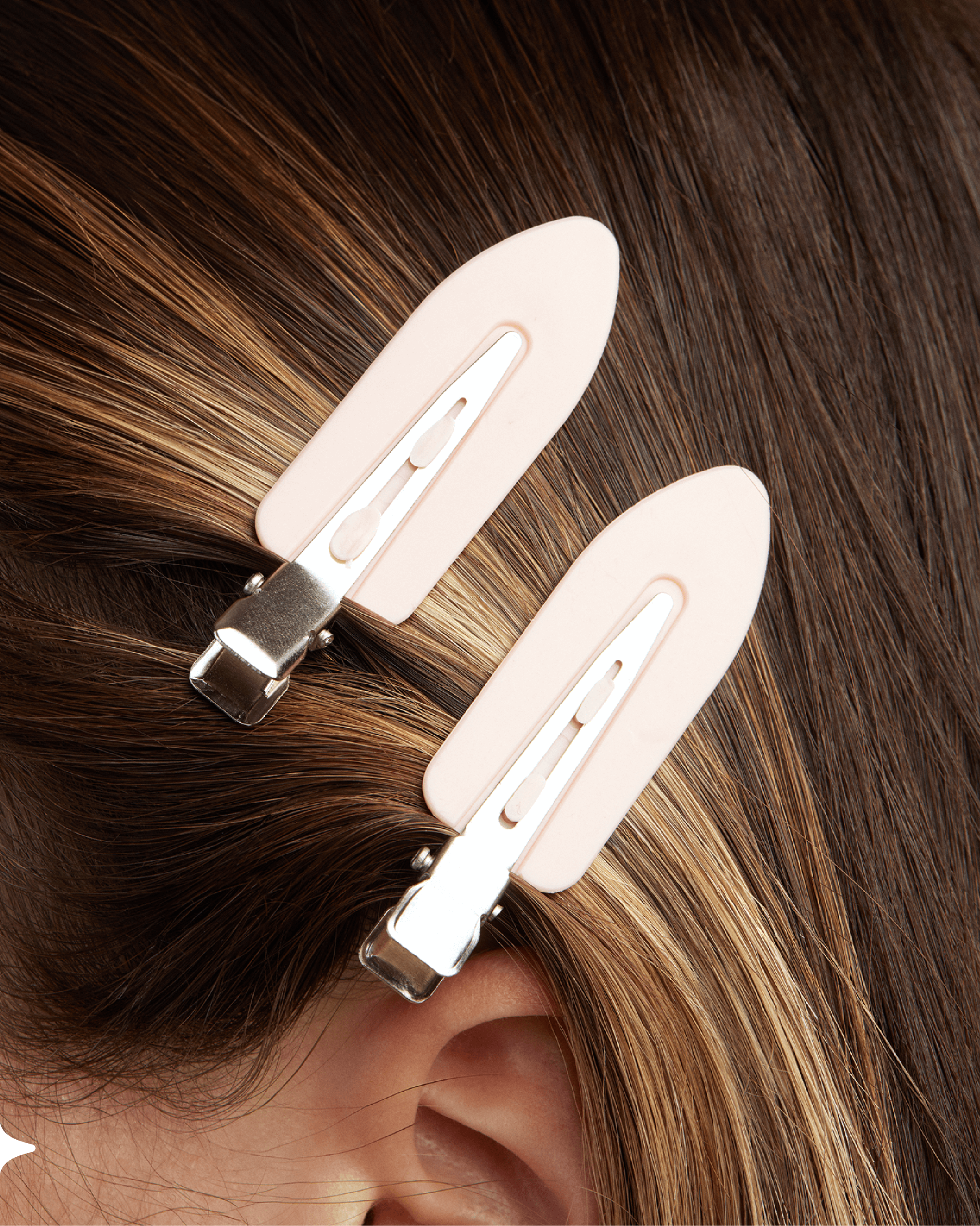 Sitting Pretty branded hair clips in a woman's hair