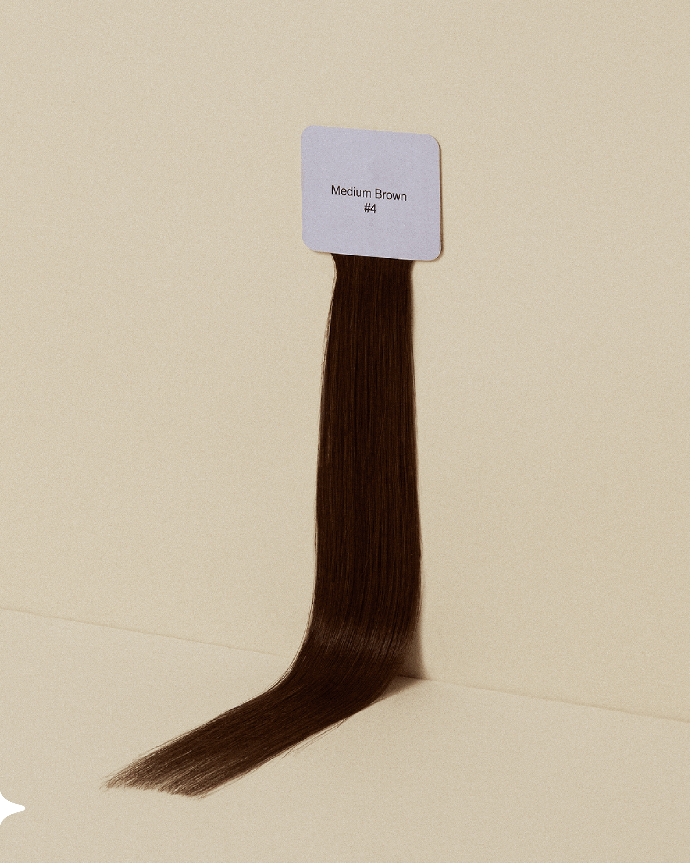 A medium brown Sitting Pretty halo hair extension color swatch