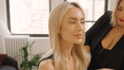 A professional hair stylist showing how to find your perfect halo hair extension color match